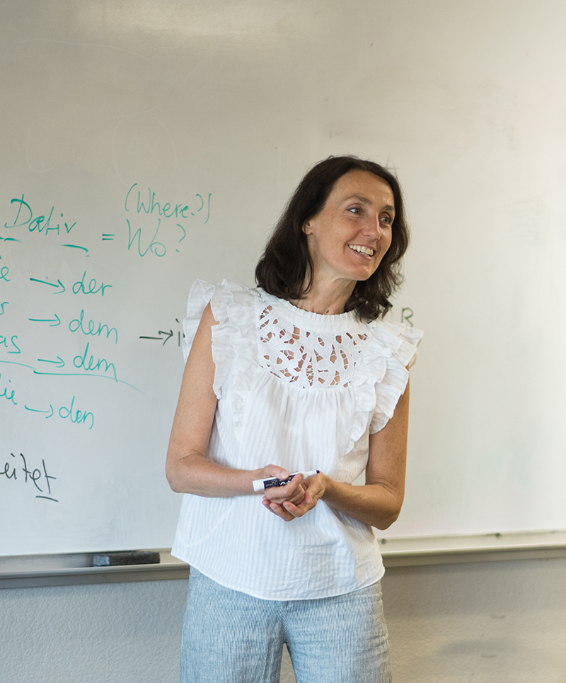 About-Teach-3 Intermediate Adult class teacher teaching grammar.